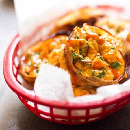 Buffalo Chicken Egg Muffin Recipe - Protein Packed and ready in 20 minutes, these are perfect for a healthy on the go breakfast or game day bite! | Foodfaithfitness.com | #recipe